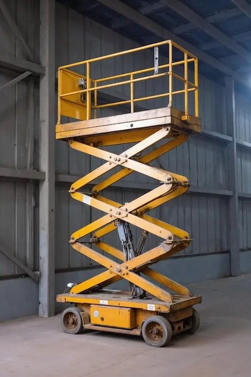 yellow-scissor-lift-industrial-setting_1410957-94656